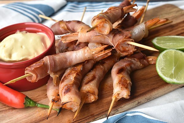 Prawns wrapped in prosciutto, skewered and grilled, served with lemon &  aioli – Australian Prawns